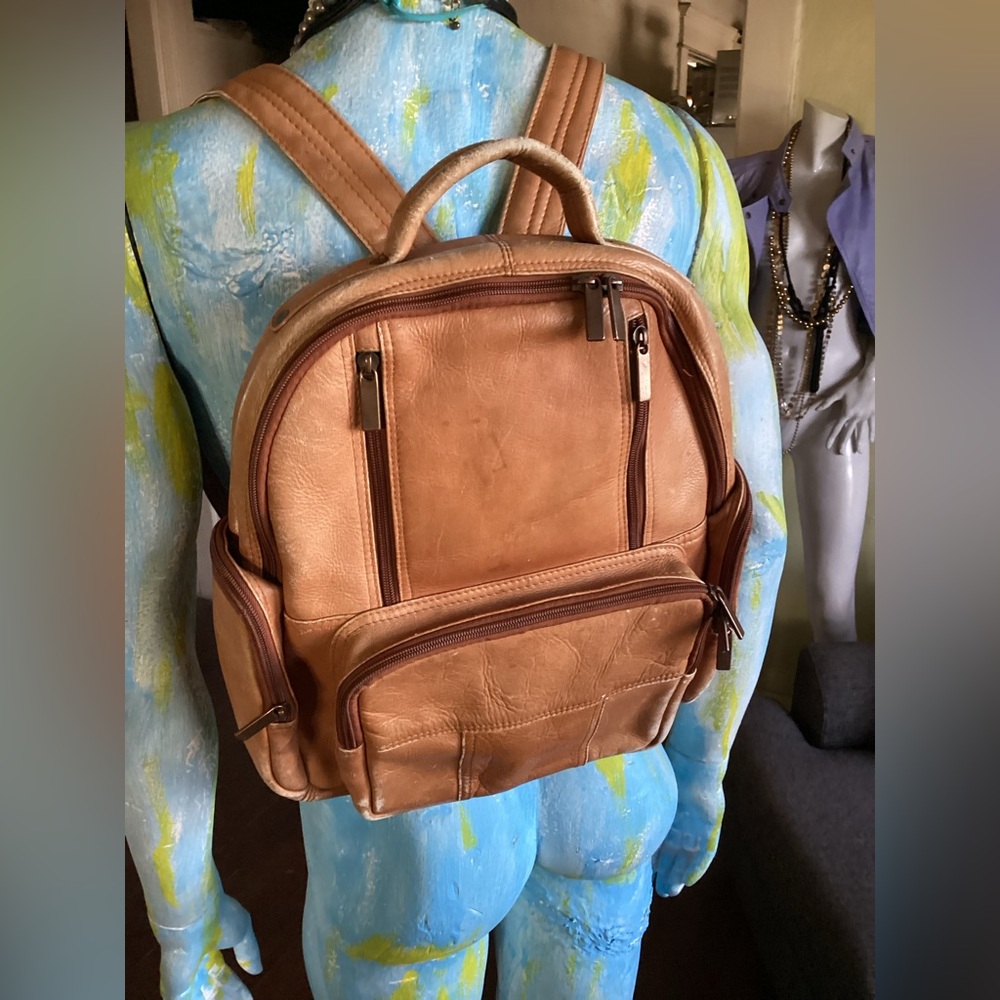 Vintage tan leather backpack made in made in Colombia